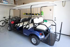 a golf cart parked in a garage at Mauna Lani KaMilo 217 in Waikoloa