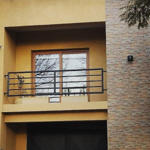 a balcony with a window on a building at Inti. in Saladillo
