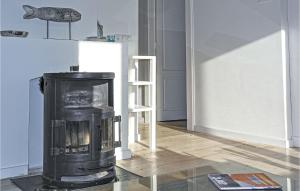 a living room with a black stove in a room at Nautilus 1 in Bergen aan Zee