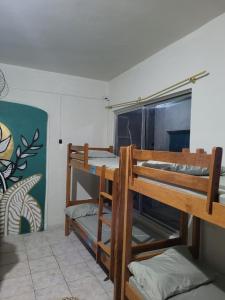 a room with two bunk beds and a window at Espaço do Bem Recife in Recife