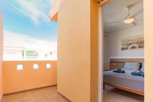 a bedroom with a bed and a large window at Casa Gris in Orihuela Costa +16 photos