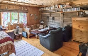 a living room with a couch and a table at Gorgeous Home In Enviken With Kitchen in Enviken