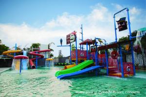 a water park with a water slide in the water at Meritas Picaddle Resort Lonavala in Lonavala