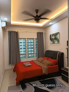 a bedroom with a bed and a ceiling fan at QAISARA D'SAVANNA HOMESTAY@SOUTHVILLE CITY in Bangi