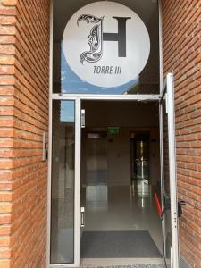 an entrance to a torre iii building with an open door at TORRES H in Córdoba