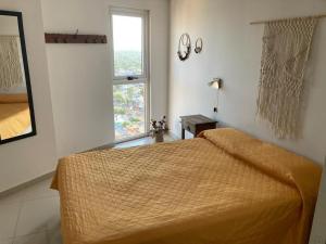 a bedroom with a bed and a window at TORRES H in Córdoba