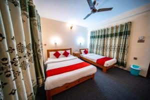 Uma cama ou camas num quarto em Dharma Backpackers