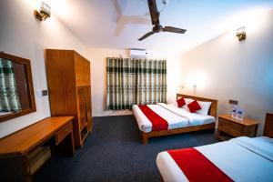 Uma cama ou camas num quarto em Dharma Backpackers