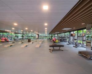 a large room with benches in a building at Pool View Marvest Huahin by Wilmot in Hua Hin