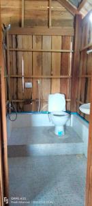 a bathroom with a toilet and a sink at Sok Mean Bungalows in Koh Rong Sanloem