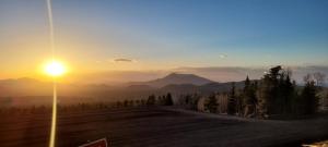 a sunset on a mountain with a street light at CASTLE ROCK in Flagstaff