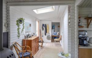 a kitchen with white walls and a hallway with chairs at Stunning Home In Anholt With Wifi in Anholt