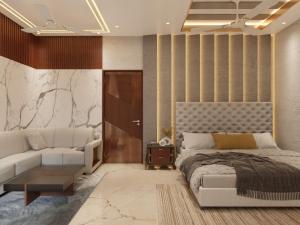 a bedroom with a bed and a couch at Green Mapple in Muzaffarpur +47 photos