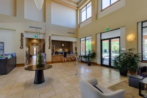 a lobby with chairs and a table in a building at 4 Bedrooms 3,5 Bathrooms Regal Oaks 2713 Il in Orlando