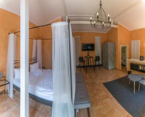 Un pat sau paturi într-o cameră la Albergo-Toscana