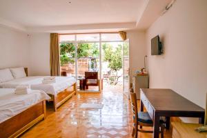 Postel nebo postele na pokoji v ubytování Thiên Tân Hotel