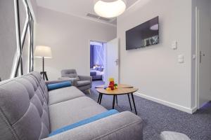 Televízia a/alebo spoločenská miestnosť v ubytovaní Park Hotel Bydgoszcz