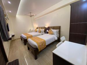 Voodi või voodid majutusasutuse Le Shiv Executive Suite toas
