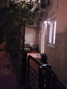a hallway of a building with a window and a laptop at Heraklion modern studio 40 sq.m. near town center. in Heraklio