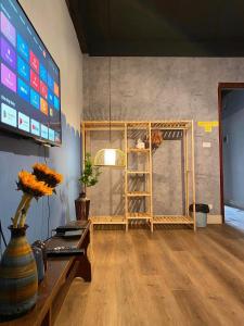 a room with a large screen with a ladder in it at Homestay Casa 69 in Hanoi