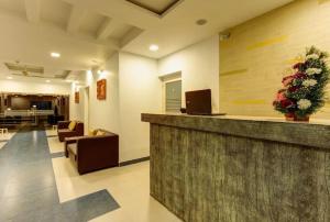 a lobby of a hospital with a reception counter at Iceberg Hill View Resort Munnar in Munnar