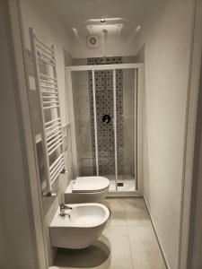 a bathroom with a toilet and a sink and a shower at Casa Anelita in La Spezia