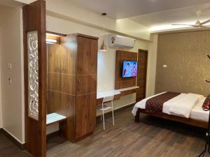 Voodi või voodid majutusasutuse Le Shiv Executive Suite toas