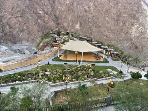 an aerial view of a park with a large tent at Discover Khorfkan in Khor Fakkan