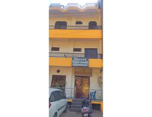 a building with a motorcycle parked in front of it at Hotel Prem Sagar, Agra Cantt in Agra