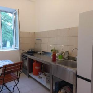 a kitchen with a sink and a counter top at Gradina de Vara Sulina in Sulina