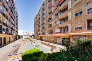 an empty street in front of a building at Casa Carmelina in Torrevieja