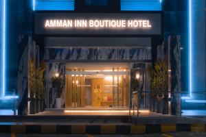 an entrance to an amazon inn boutique hotel at night at Amman Inn Boutique Hotel in Amman