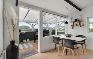a kitchen and dining room with a table and chairs at Pet Friendly Home In Hejls With Wifi in Hejls