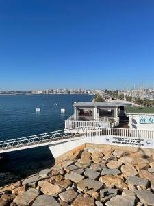 a bridge over a large body of water at Almuden's yellow apartment, HIGH-SPEED FREE WIFI, 250m to Beach, The center of Torrevieja in Torrevieja