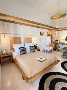 a bedroom with a large bed in a room at Spongia Apartments and Suites Kalymnos in Kalymnos