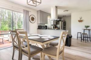 a kitchen and dining room with a table and chairs at Updated home near Fort Jackson in Columbia