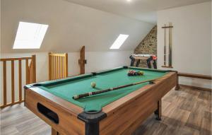 a pool table in a living room with a pool table at 4 Bedroom Stunning Home In Fierville-les-mines in Fierville-les-Mines