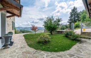 a patio with a yard with plants and trees at Stunning Home In Castino With Wifi And 4 Bedrooms in Castino