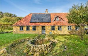 an old stone house with a solar roof at 2 Bedroom Stunning Apartment In Aabenraa in Aabenraa