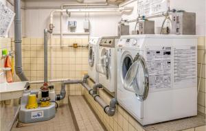 a laundry room with a washer and dryer at Lovely Apartment In Schleswig With Wifi in Schleswig