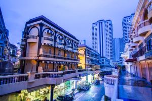 a group of buildings in a city with tall buildings at Zing Resort & Spa in Pattaya South