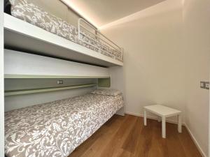 A bed or beds in a room at Due Lune Home