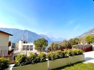 a view of the mountains from a house at Due Lune Home in Malcesine