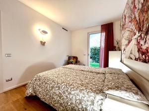 A bed or beds in a room at Due Lune Home