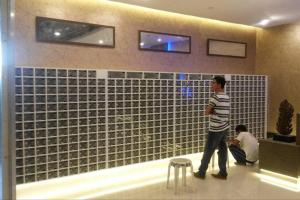 a man standing in front of a tile wall at Unit Near SM City,Gaisano Mall of Cebu,Robinsons Galleria in Cebu City