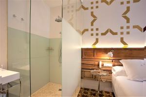 Postel nebo postele na pokoji v ubytování Hotel Madinat