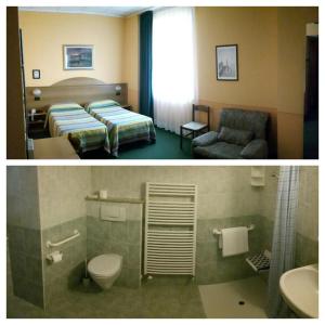 a hotel room with a bed and a bathroom at Hotel Azalea in Baveno