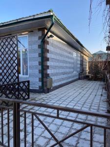 a house with a large patio in front of it at Коттедж Чок-Тал Цо Париж 2 in Chok-Tal