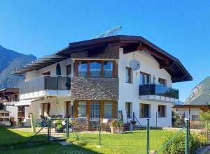 a house with a roof on top of it at Alpineas in Leutasch