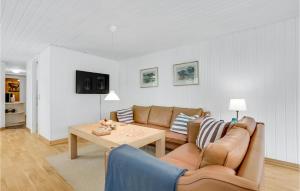 a living room with a couch and a table at Stunning Home In Gistrup With Wifi in Gistrup